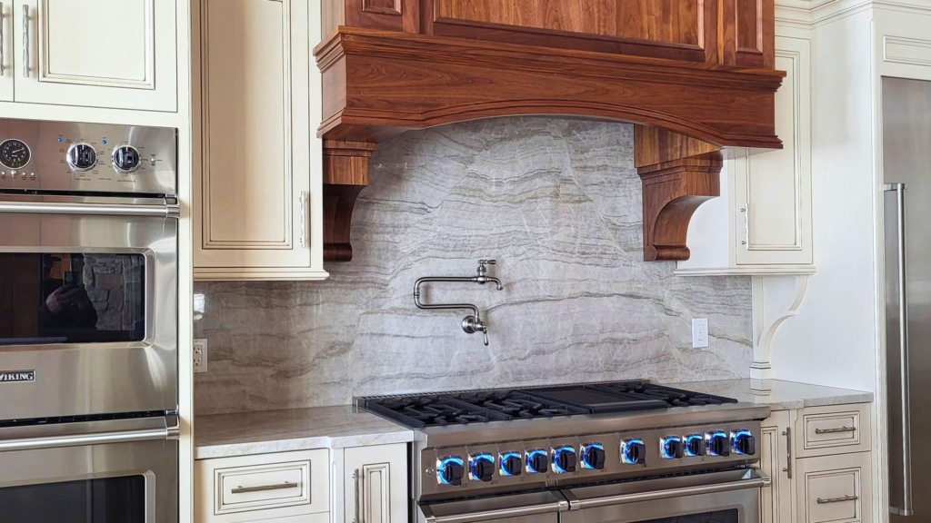 Custom Amish-built kitchen cabinets with wood range hood in Valparaiso, Indiana